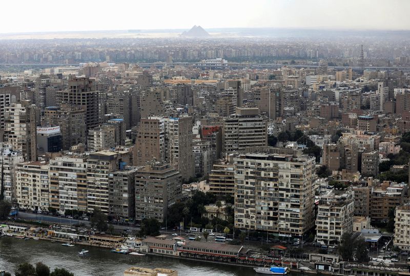 A general view of buildings and the Great Pyramids in Cairo, Egypt, March 25, 2026. REUTERS/Mohamed Abd El Ghany