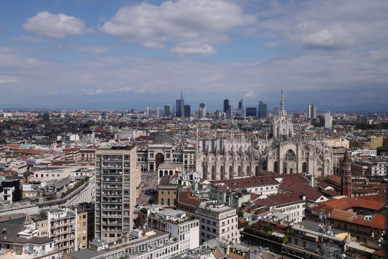 A view of Duomo Cathedral and in the background Porta Garibaldi business district, in Milan, Italy, April 22, 2026. REUTERS/Claudia Greco