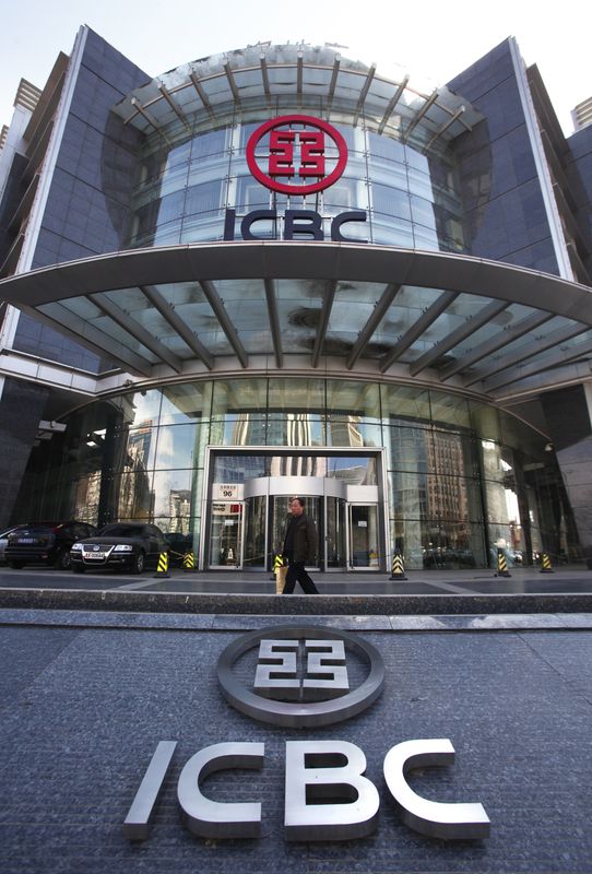 A man walks past a branch of the Industrial & Commercial Bank of China (ICBC) in the financial district of Beijing March 25, 2010. ICBC, the world's most valuable lender, reports its quarterly results on Thursday. REUTERS/David Gray (CHINA - Tags: BUSINESS IMAGES OF THE DAY)