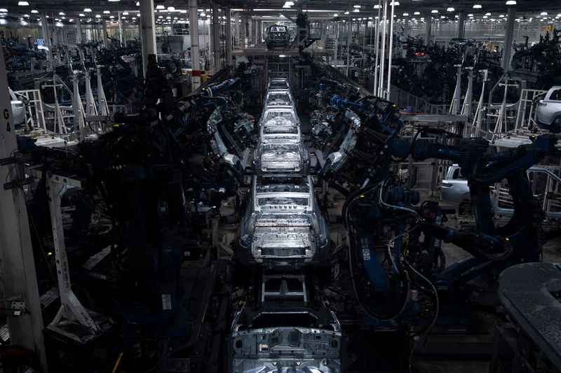 FILE PHOTO: Machinery assembles second-generation R1 vehicles at electric auto maker Rivian's manufacturing facility in Normal, Illinois, U.S. June 21, 2024. REUTERS/Joel Angel Juarez/File Photo