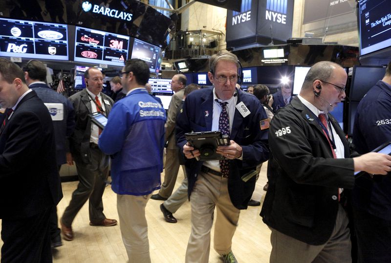 Traders work on the main trading floor of the New York Stock Exchange shortly after the opening bell of the trading session in the Manhattan borough of New York City, January 7, 2016. Wall Street was set to open sharply lower for a second straight day on Thursday after China allowed the yuan to fall further and oil prices slid to near 12-year lows, raising concerns over the state of the global economy. REUTERS/Brendan McDermid
