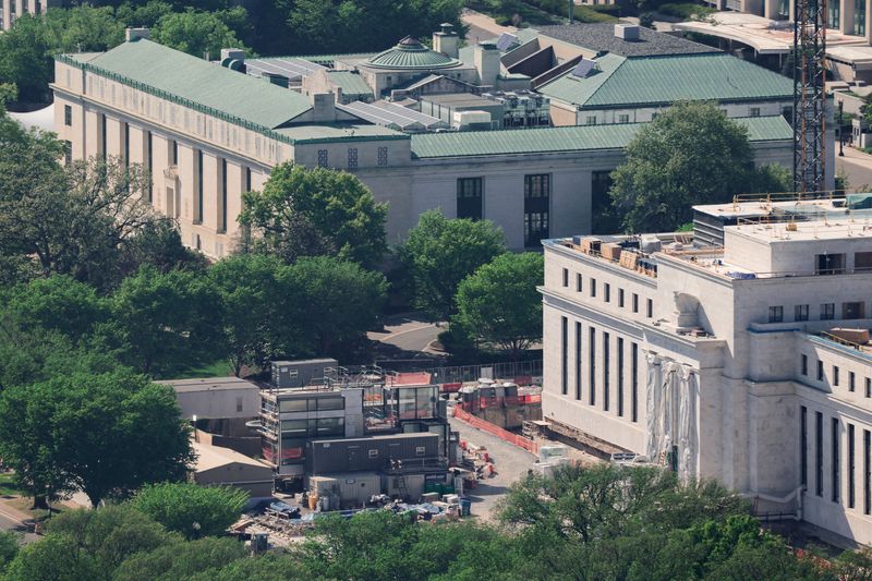 FILE PHOTO: The Federal Reserve building undergoes construction in Washington, D.C., U.S., April 16, 2026. REUTERS/Kylie Cooper/File Photo
