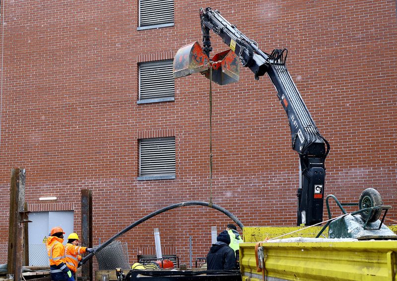 Workers lay a 110 kilovolt high-voltage cable on a construction site in southern Berlin, Germany, January 6, 2026. REUTERS/Lisi Niesner