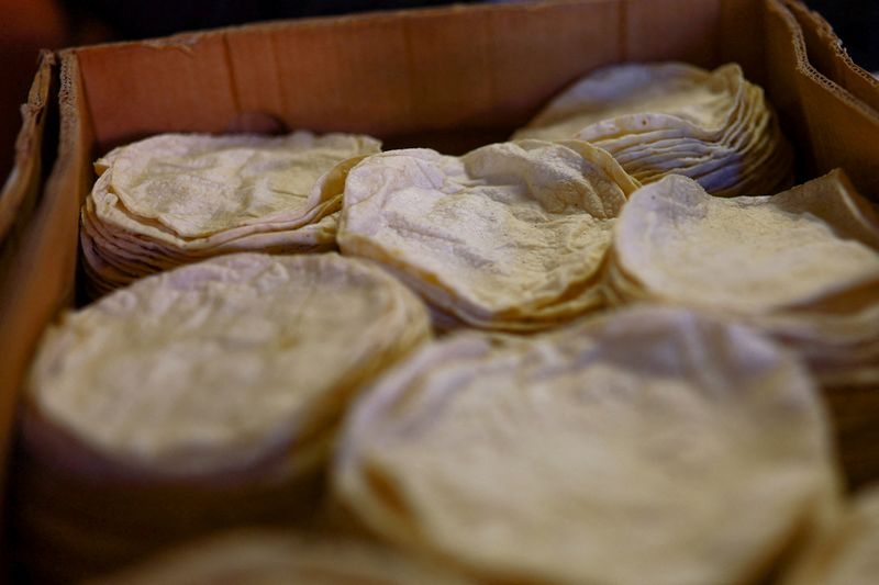 FILE PHOTO: Tortillas in a box at a tortilla business following March's inflation surge driven by rising food and energy prices, in Ciudad Juarez, Mexico, April 15, 2026. REUTERS/Jose Luis Gonzalez/File Photo
