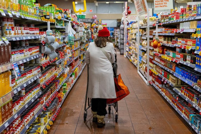 FILE PHOTO: A person shops in a grocery store in Toronto, Ontario, Canada, January 26, 2026. REUTERS/Carlos Osorio/File Photo