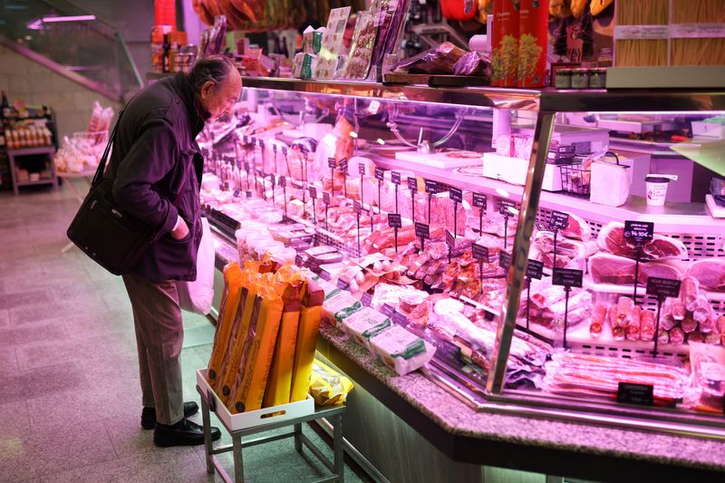 A man shops at a local market in Madrid, Spain, February 21, 2026. REUTERS/Alejandro Martinez Velez