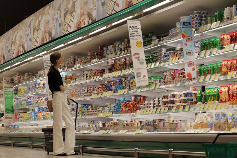 A customer shops for dairy products at a supermarket in Saint Petersburg, Russia June 28, 2024.  REUTERS/Anton Vaganov