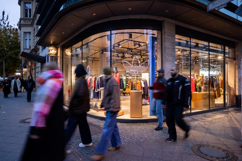 People walk past an Adidas store at Scheunenviertel quarter in Berlin, Germany, November 15, 2024. REUTERS/Lisi Niesner