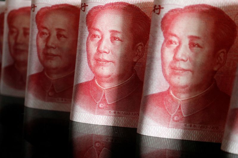 FILE PHOTO: Chinese yuan banknotes are seen in this illustration picture taken April 25, 2022. REUTERS/Florence Lo/Illustration/File Photo