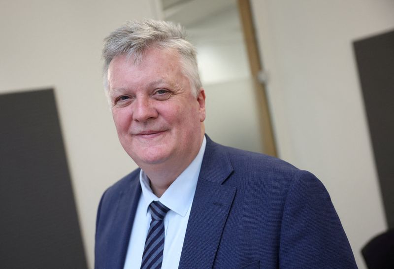 FILE PHOTO: Chief Economist and Executive Director for Monetary Analysis and Research at the Bank of England Huw Pill poses for a portrait following an interview with Reuters at the Bank of England in London, Britain, February 12, 2025. REUTERS/Suzanne Plunkett/File Photo