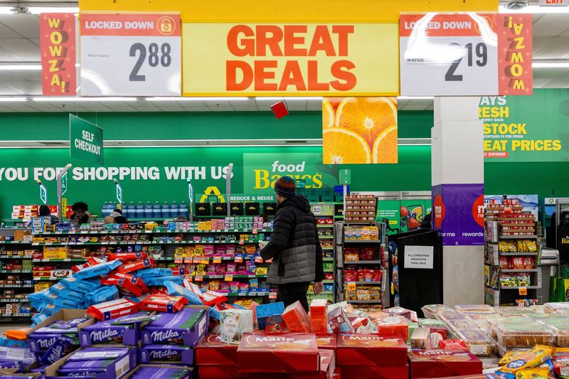 FILE PHOTO: People shop in a grocery store in Mississauga, Ontario, Canada, January 26, 2026. REUTERS/Carlos Osorio/File Photo