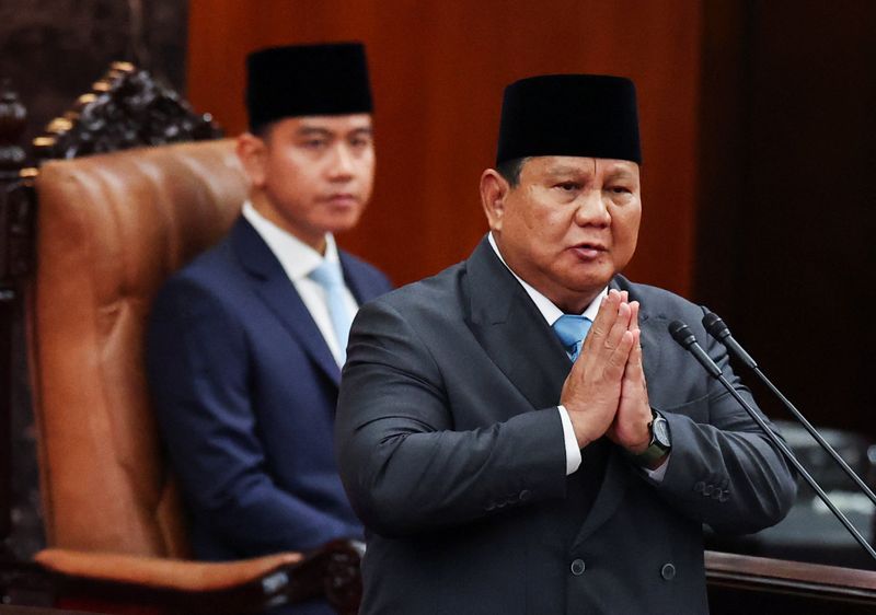 Indonesian President Prabowo Subianto gestures inside the parliament building, while Vice President Gibran Rakabuming Raka looks on near him, on the day Subianto is set to deliver his speech on economic policies and the 2027 fiscal plan in Jakarta, Indonesia, May 20, 2026. REUTERS/Willy Kurniawan