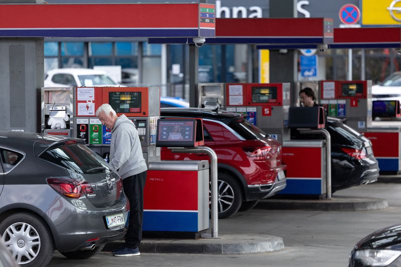 A man refills fuel in his car at a petrol station in Ljubljana, Slovenia, March 22, 2026. REUTERS/Antonio Bronic
