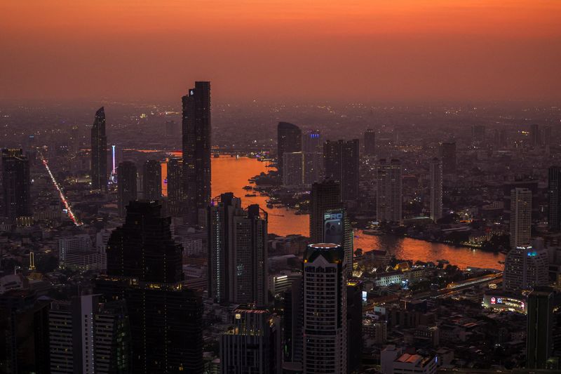 Twilight falls over the Bangkok skyline on New Year's Eve, in Bangkok, Thailand, December 31, 2025. REUTERS/Chalinee Thirasupa
