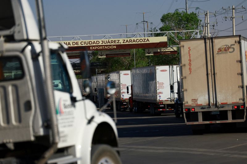 FILE PHOTO: Trucks wait in a queue at the Zaragoza-Ysleta border crossing bridge to cross into the U.S., while the governments of Mexico and the U.S. are set to begin a bilateral review of the USMCA trade agreement in mid March ahead of a joint assessment that will also include Canada, in Ciudad Juarez, Mexico March 12, 2026. REUTERS/Jose Luis Gonzalez/File Photo