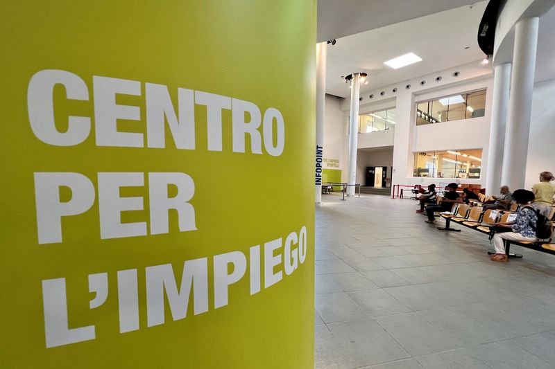 People wait at an employment centre in Milan, Italy June 14, 2022. Picture taken June 14, 2022. REUTERS/Flavio Lo Scalzo
