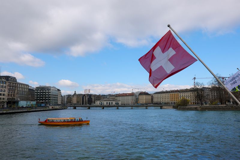 A Swiss flag and a mouette boat, as seen from the Mont Blanc bridge, in Geneva, Switzerland, March 18, 2026. REUTERS/Denis Balibouse