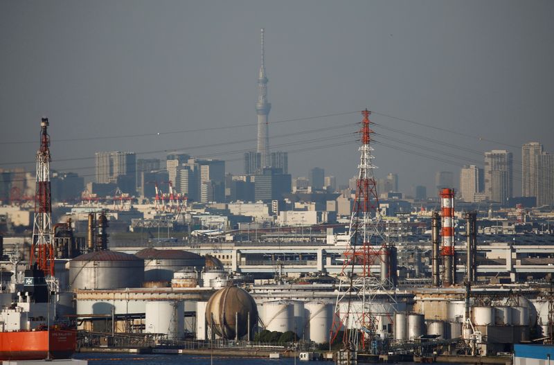 Chimneys of an industrial complex and Tokyo's skyline are seen from an observatory deck at an industrial port in Kawasaki, Japan, October 24, 2016. REUTERS/Kim Kyung-Hoon