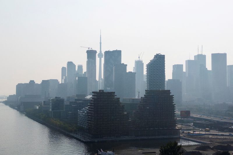 A hazy view of the skyline in Toronto, Ontario, Canada, July 14, 2025. REUTERS/Carlos Osorio