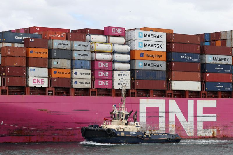 A tugboat escorts the container ship "One Cosmos" as it leaves Port Botany in Sydney, Australia, April 22, 2026. REUTERS/Hollie Adams