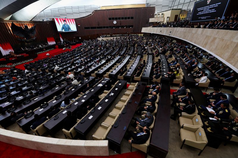 FILE PHOTO: A large screen displays Indonesian President Prabowo Subianto as he delivers his speech on economic policies and the 2027 fiscal plan to parliament members at the parliament building in Jakarta, Indonesia, May 20, 2026. REUTERS/Willy Kurniawan/File Photo