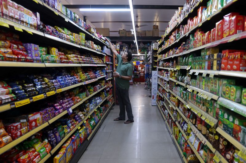 A customer picks a product from a rack at a supermarket in Bengaluru, India, June 3, 2026. REUTERS/Priyanshu Singh