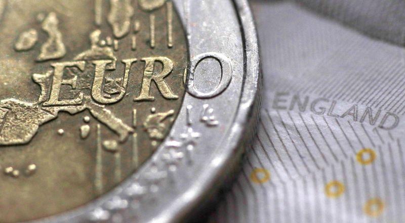 A two Euro coin is pictured next to an English ten Pound note in an illustration taken March 16, 2016.  REUTERS/Phil Noble/Illustration