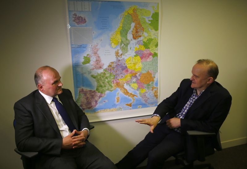 Brothers with opposing views on Europe Ian Baxter (R) and Nigel Baxter speak in the offices of Baxter Freight in Nottingham, Britain March 22, 2016. REUTERS/Darren Staples/File Photo