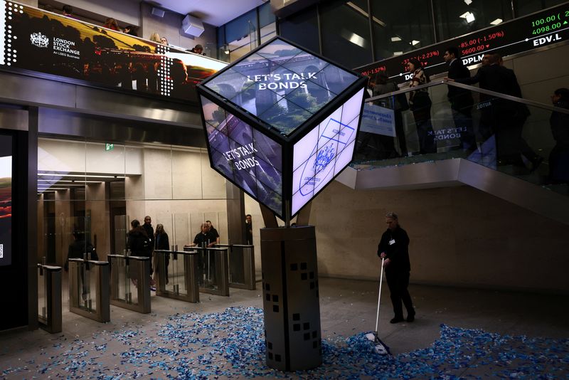 A worker cleans confetti after the opening of the markets at the London Stock Exchange in London, Britain January 19, 2026. REUTERS/Jack Taylor