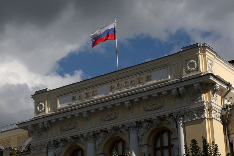 FILE PHOTO: A flag flies above the headquarters of the Russian Central Bank on the day of a meeting, held to set its benchmark interest rate, in Moscow, Russia, September 12, 2025. REUTERS/Ramil Sitdikov/File Photo