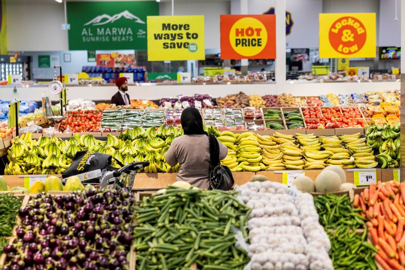 Customers browse the produce section in Chalo FreshCo grocery store in Brampton, Ontario, Canada, June 5, 2026. REUTERS/Carlos Osorio