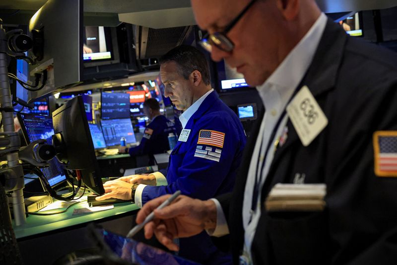 Traders work on the floor at the New York Stock Exchange (NYSE) in New York City, U.S., June 22, 2026.  REUTERS/Brendan McDermid