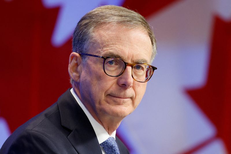FILE PHOTO: Bank of Canada Governor Tiff Macklem takes part in a press conference, after cutting key interest rate, in Ottawa, Ontario, Canada September 17, 2025. REUTERS/Blair Gable/File Photo