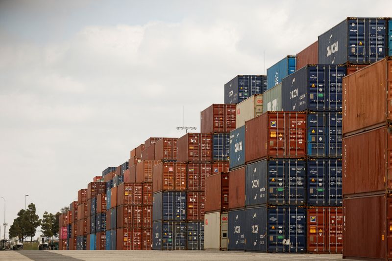 FILE PHOTO: Shipping containers are stacked at the port of Los Angeles in Long Beach, California, U.S., March 10, 2026. REUTERS/Caroline Brehman/File Photo