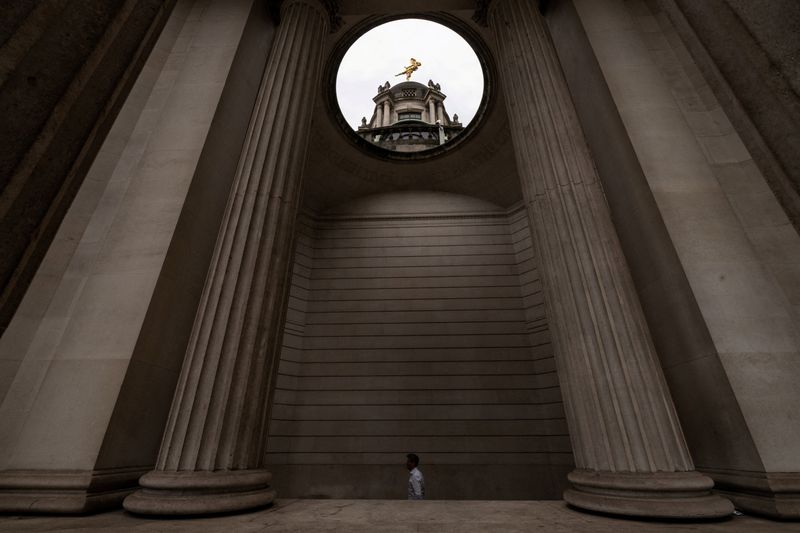 A city worker walks through a passage at the Bank of England in London, Britain, June 8, 2026. REUTERS/Chris J. Ratcliffe