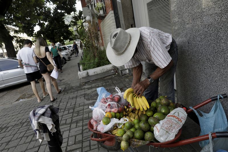A street vendor sells fruits in Rio de Janeiro, Brazil April 8, 2022. REUTERS/Ricardo Moraes