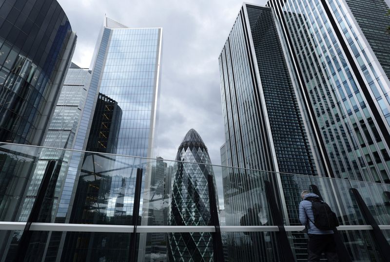 A visitor looks out from the viewing area of Garden at 120 with commercial skyscrapers including The Gherkin seen behind, in the City of London financial district, in London, Britain, September 23, 2025. REUTERS/Toby Melville