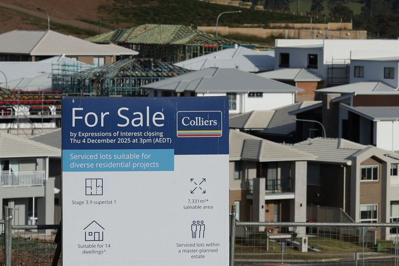 A 'For Sale' sign stands in front of newly constructed and under-construction homes, in the suburb of Menangle Park, in Sydney, Australia, June 10, 2026. REUTERS/Hollie Adams