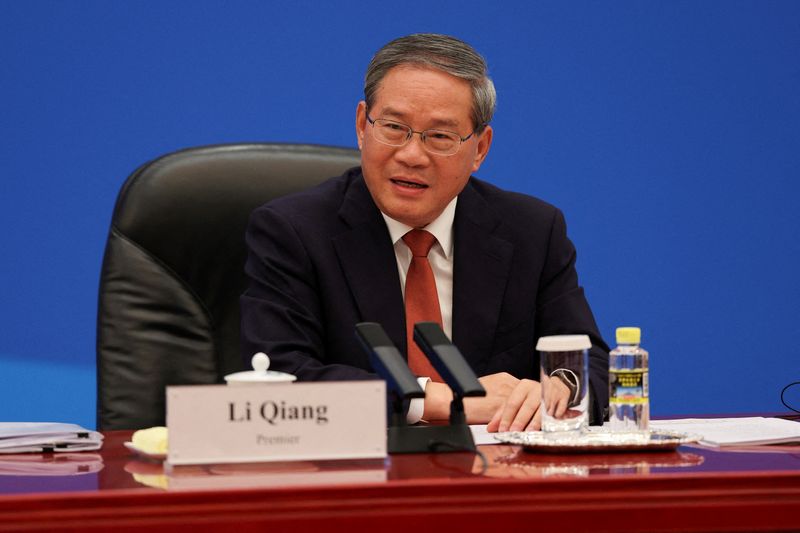 FILE PHOTO: Chinese Premier Li Qiang meets with U.S. business representatives, at the Great Hall of the People in Beijing, China May 14, 2026. REUTERS/Go Nakamura/Pool/File Photo