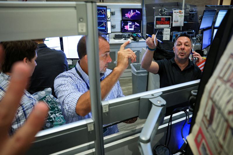 Futures-options traders work on the floor at the New York Stock Exchange's NYSE American (AMEX) in New York City, U.S. July 14, 2026.  REUTERS/Brendan McDermid