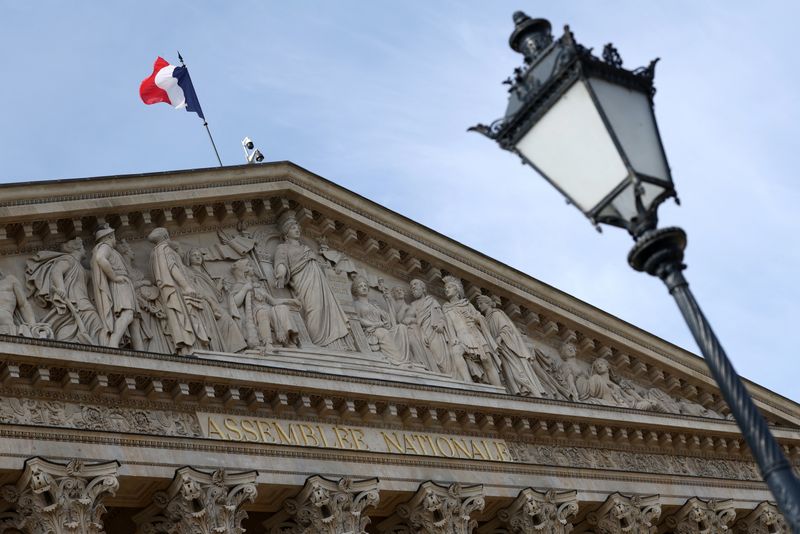 A French flag flies over the National Assembly in Paris, France, April 16, 2026. REUTERS/Tom Nicholson