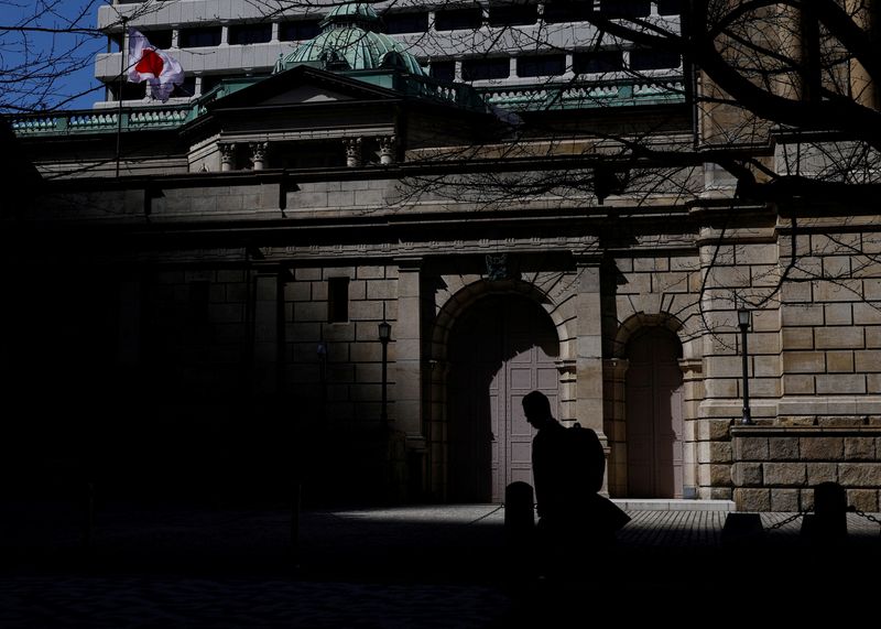 A man walks past the Bank of Japan building in Tokyo, Japan, March 18, 2024. REUTERS/Kim Kyung-Hoon