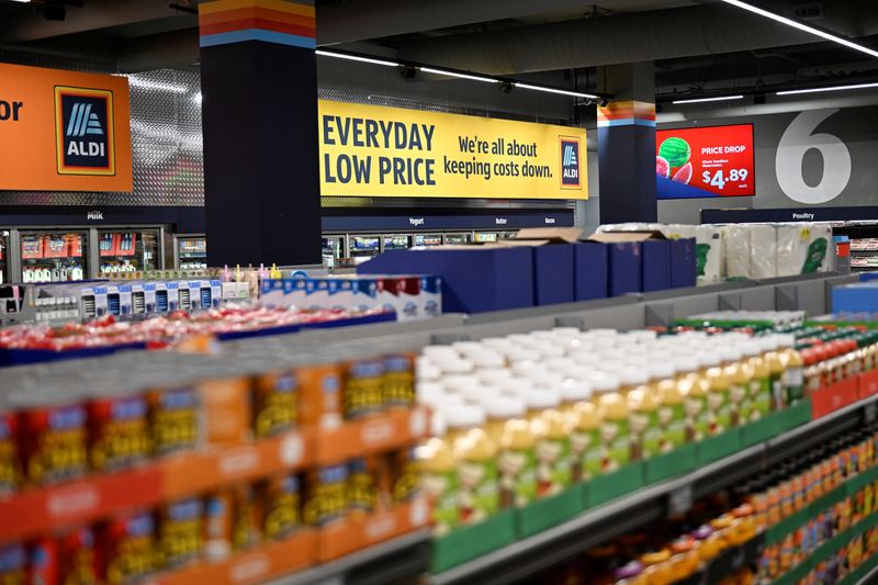Signage on display above the aisles in an Aldi grocery store in New York City, U.S. June 17, 2026.    REUTERS/Vincent Alban