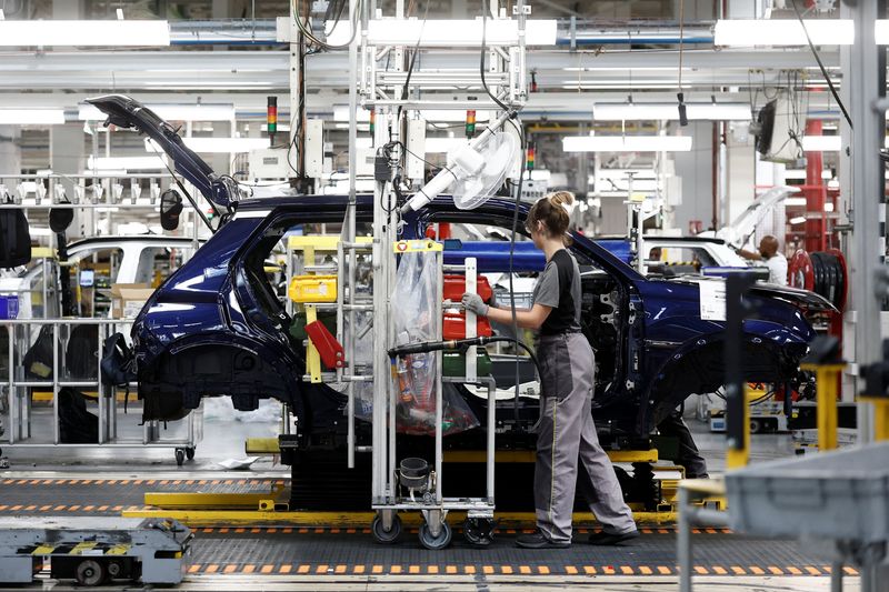 An employee uses an electric fan while working at the automotive assembly line for the electric Renault R5 E-Tech, within Ampere ElectriCity, at the Renault factory in Douai, France, July 15, 2026. REUTERS/Benoit Tessier