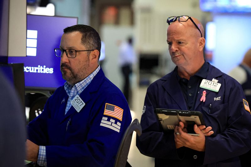 Traders work on the floor at the New York Stock Exchange (NYSE) in New York City, U.S., July 28, 2026.  REUTERS/Brendan McDermid