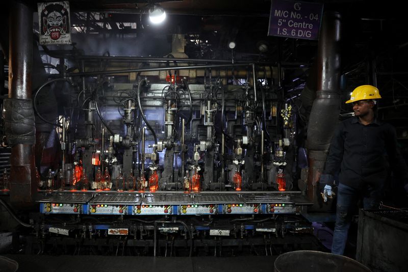 Glass bottles are being manufactured inside a glass factory, in Firozabad in the northern state of Uttar Pradesh, India, March 26, 2026. REUTERS/Bhawika Chhabra