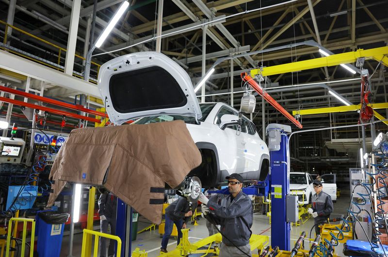 Employees work at the assembly line of the Moscow Automobile Factory Moskvich, in Moscow, Russia, November 23, 2022. REUTERS/Evgenia Novozhenina