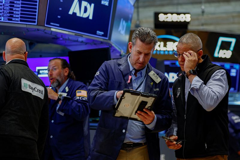 Traders work on the floor of the New York Stock Exchange (NYSE) in New York City, U.S., August 4, 2026. REUTERS/Jeenah Moon