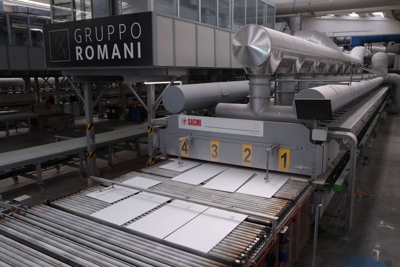 Tiles come out of industrial gas kilns at Gruppo Romani ceramics factory production line in Rubiera, Italy, April 30, 2026. REUTERS/Claudia Greco