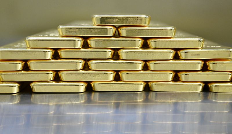 Gold bars are stacked in the safe deposit boxes room of the Pro Aurum gold house in Munich, Germany, January 10, 2025. REUTERS/Angelika Warmuth